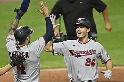 Jun 29, 2022; Cleveland, Ohio, USA; Minnesota Twins right fielder Max Kepler (26) celebrates his two-run home run with shortstop Carlos Correa (4) in the tenth inning against the Cleveland Guardians at Progressive Field. Mandatory Credit: David Richard-USA TODAY Sports