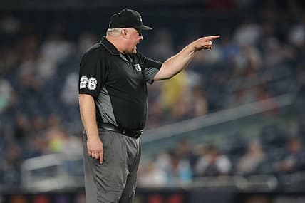 Jun 6, 2021; Bronx, New York, USA; second base umpire Bill Miller (26) ejects New York Yankees bench coach Carlos Mendoza (not pictured) during the tenth inning at Yankee Stadium. Mandatory Credit: Brad Penner-USA TODAY Sports