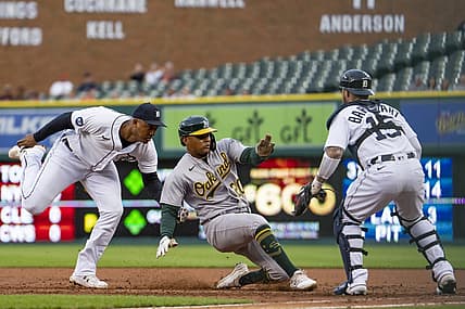 May 11, 2022; Detroit, Michigan, USA; Detroit Tigers second baseman Jonathan Schoop (7) tags out Oakland Athletics center fielder Cristian Pache (20) before he gets back to first base during the second inning at Comerica Park. Mandatory Credit: Raj Mehta-USA TODAY Sports