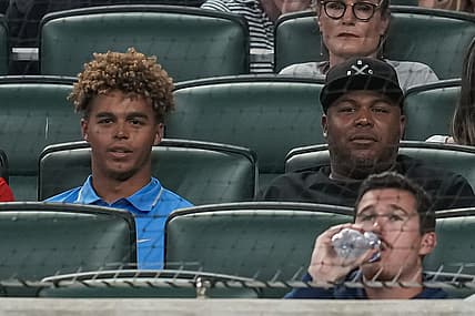Jun 7, 2022; Cumberland, Georgia, USA; Former Atlanta Braves player Andruw Jones (right) and his son Druw watch the game between the Braves and the Oakland Athletics during the sixth inning at Truist Park. Mandatory Credit: Dale Zanine-USA TODAY Sports