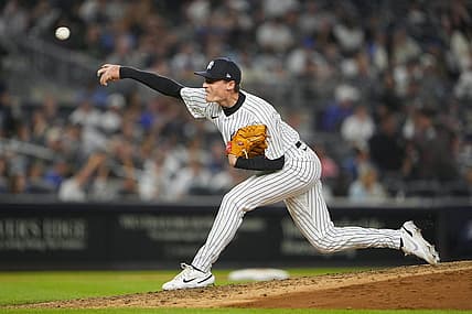 Jun 11, 2022; Bronx, New York, USA; New York Yankees pitcher Ron Marinaccio (97) delivers a pitch against the Chicago Cubs during the eighth inning at Yankee Stadium. Mandatory Credit: Gregory Fisher-USA TODAY Sports