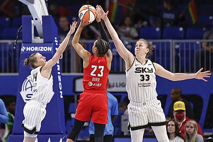 Jun 17, 2022; Chicago, Illinois, USA; Atlanta Dream guard Asia Durr (23) shoots against Chicago Sky guard Allie Quigley (14) and forward Emma Meesseman (33) during the second half of a WNBA game at Wintrust Arena. Mandatory Credit: Kamil Krzaczynski-USA TODAY Sports