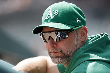 May 12, 2022; Detroit, Michigan, USA; Oakland Athletics manager Mark Kotsay (7) watches from the dugout in the first inning against the Detroit Tigers at Comerica Park. Mandatory Credit: Rick Osentoski-USA TODAY Sports