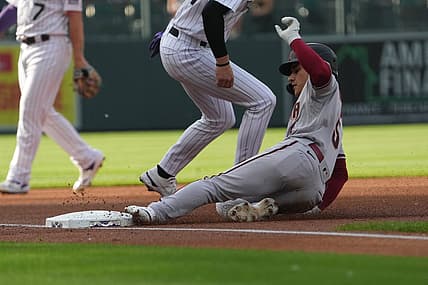 Jul 1, 2022; Denver, Colorado, USA; Arizona Diamondbacks center fielder Alek Thomas (5) RBI triples in the first inning against the Colorado Rockies at Coors Field. Mandatory Credit: Ron Chenoy-USA TODAY Sports