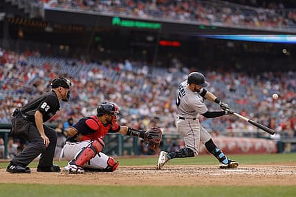 Jul 1, 2022; Washington, District of Columbia, USA; Miami Marlins third baseman Jon Berti (5) hits a sacrifice fly RBI against the Washington Nationals during the fifth inning at Nationals Park. Mandatory Credit: Geoff Burke-USA TODAY Sports