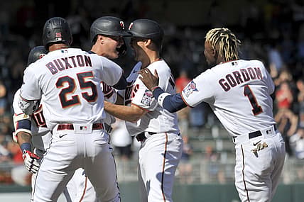 Jul 2, 2022; Minneapolis, Minnesota, USA; Minnesota Twins pinch hitter Jose Miranda (left center) reacts with center fielder Nick Gordon (1), designated hitter Byron Buxton (25), left fielder Alex Kirilloff (right center) and teammates after hitting a walk off single against Baltimore Orioles relief pitcher Jorge Lopez (not pictured) during the ninth inning at Target Field. Mandatory Credit: Jeffrey Becker-USA TODAY Sports