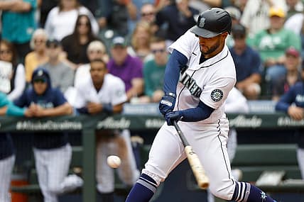 Jul 2, 2022; Seattle, Washington, USA; Seattle Mariners third baseman Abraham Toro (13) hits a walk-off RBI-single against the Oakland Athletics during the ninth inning at T-Mobile Park. Seattle defeated Oakland, 2-1. Mandatory Credit: Joe Nicholson-USA TODAY Sports