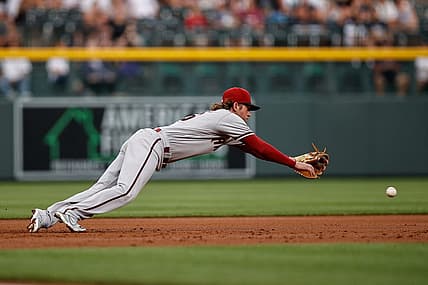 Jul 2, 2022; Denver, Colorado, USA; Arizona Diamondbacks third baseman Jake Hager (16) is unable to field a ground ball in the first inning against the Colorado Rockies at Coors Field. Mandatory Credit: Isaiah J. Downing-USA TODAY Sports