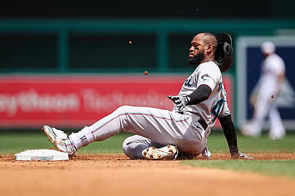 Jul 3, 2022; Washington, District of Columbia, USA; Miami Marlins left fielder Bryan De La Cruz (14) slides safely into second after hitting a double against the Washington Nationals during the third inning at Nationals Park. Mandatory Credit: Scott Taetsch-USA TODAY Sports