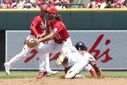 Jul 3, 2022; Cincinnati, Ohio, USA; Atlanta Braves right fielder Ronald Acuna Jr. (13) steals second against Cincinnati Reds second baseman Max Schrock (32) during the third inning at Great American Ball Park. Mandatory Credit: David Kohl-USA TODAY Sports