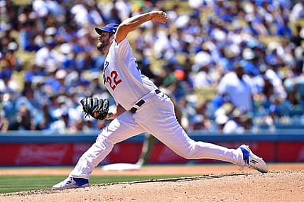 Jul 3, 2022; Los Angeles, California, USA; Los Angeles Dodgers starting pitcher Clayton Kershaw (22) throws against the San Diego Padres during the fourth inning at Dodger Stadium. Mandatory Credit: Gary A. Vasquez-USA TODAY Sports