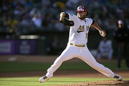 Jul 4, 2022; Oakland, California, USA; Oakland Athletics starting pitcher Cole Irvin (19) delivers a pitch against the Toronto Blue Jays in the second inning at RingCentral Coliseum. Mandatory Credit: D. Ross Cameron-USA TODAY Sports