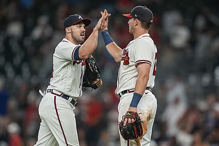 Jul 5, 2022; Cumberland, Georgia, USA; Atlanta Braves left fielder Adam Duvall (14) and third baseman Austin Riley (27) react after the Braves defeated the St. Louis Cardinals at Truist Park. Mandatory Credit: Dale Zanine-USA TODAY Sports