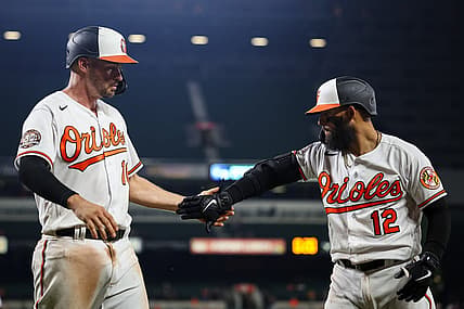 Jul 5, 2022; Baltimore, Maryland, USA; Baltimore Orioles first baseman Trey Mancini (16) celebrates with second baseman Rougned Odor (12) after scoring against the Texas Rangers during the seventh inning at Oriole Park at Camden Yards. Mandatory Credit: Scott Taetsch-USA TODAY Sports