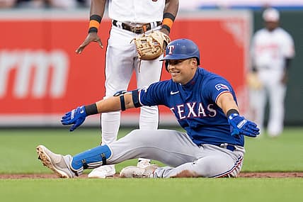 Jul 6, 2022; Baltimore, Maryland, USA; Texas Rangers first baseman Nathaniel Lowe (30) celebrates after hitting a double during the second inning at Oriole Park at Camden Yards. Mandatory Credit: Jessica Rapfogel-USA TODAY Sports