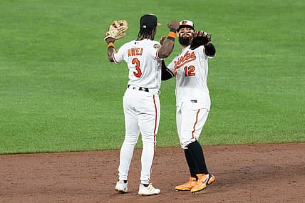 Jul 6, 2022; Baltimore, Maryland, USA; Baltimore Orioles shortstop Jorge Mateo (3) and second baseman Rougned Odor (12) celebrate after defeating the Texas Rangers at Oriole Park at Camden Yards. Mandatory Credit: Jessica Rapfogel-USA TODAY Sports