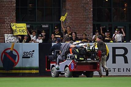 Jul 7, 2022; San Diego, California, USA; San Diego Padres left fielder Jurickson Profar (10) is carted away after a collision with shortstop C.J. Abrams (not pictured) during the fifth inning against the San Francisco Giants at Petco Park. Mandatory Credit: Orlando Ramirez-USA TODAY Sports