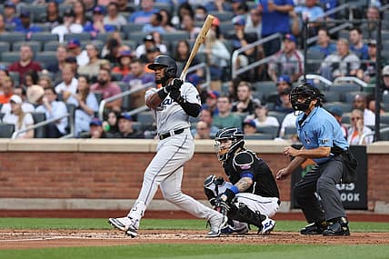 Jul 8, 2022; New York City, New York, USA; Miami Marlins left fielder Bryan De La Cruz (14) hits an RBI double during the second inning against the New York Mets at Citi Field. Mandatory Credit: Vincent Carchietta-USA TODAY Sports