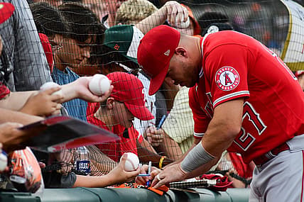 Jul 8, 2022; Baltimore, Maryland, USA;  Los Angeles Angels center fielder Mike Trout (27) sings autographs before the game against the Baltimore Orioles at Oriole Park at Camden Yards. Mandatory Credit: Tommy Gilligan-USA TODAY Sports