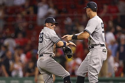 Jul 8, 2022; Boston, Massachusetts, USA; New York Yankees third baseman Josh Donaldson (28) and designated hitter Aaron Judge (99) celebrate after defeating the Boston Red Sox at Fenway Park. Mandatory Credit: Paul Rutherford-USA TODAY Sports