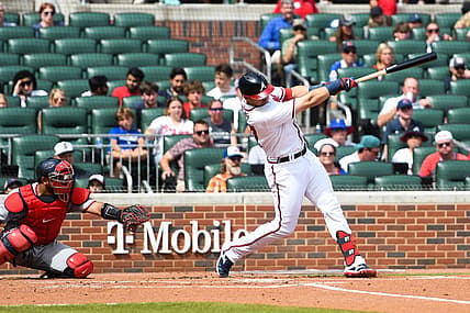 Jul 9, 2022; Cumberland, Georgia, USA; Atlanta Braves third basemen Austin Riley (27) hits a home run against the Washington Nationals at Truist Park. Mandatory Credit: Larry Robinson-USA TODAY Sports