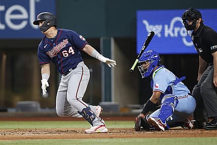 Jul 10, 2022; Arlington, Texas, USA; Minnesota Twins third baseman Jose Miranda (64) singles in a run against the Texas Rangers in the second inning at Globe Life Field. Mandatory Credit: Tim Heitman-USA TODAY Sports