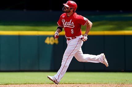 Cincinnati Reds first baseman Mike Moustakas (9) rounds the bases after hitting a three-run home during the third inning of a baseball game against the Tampa Bay Rays, Sunday, July 10, 2022, at Great American Ball Park in Cincinnati. The home run marked the 200th of his career.

Tampa Bay Rays At Cincinnati Reds July 10 0048