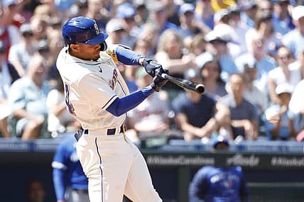 Jul 10, 2022; Seattle, Washington, USA; Seattle Mariners center fielder Julio Rodriguez hits an RBI-infield single against the Toronto Blue Jays during the fifth inning at T-Mobile Park. Mandatory Credit: Joe Nicholson-USA TODAY Sports