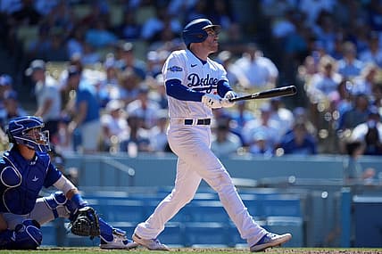 Jul 10, 2022; Los Angeles, California, USA; Los Angeles Dodgers first baseman Freddie Freeman (5) follows through on a solo home run in the sixth inning against the Chicago Cubs at Dodger Stadium. Mandatory Credit: Kirby Lee-USA TODAY Sports