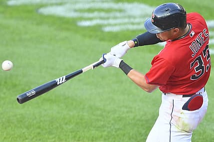 Jul 11, 2022; Cleveland, Ohio, USA; Cleveland Guardians right fielder Nolan Jones (33) hits a two-RBI single in the first inning against the Chicago White Sox at Progressive Field. Mandatory Credit: David Richard-USA TODAY Sports
