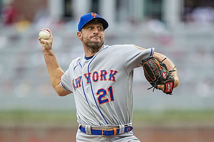 Jul 11, 2022; Cumberland, Georgia, USA; New York Mets starting pitcher Max Scherzer (21) pitches against the Atlanta Braves during the first inning at Truist Park. Mandatory Credit: Dale Zanine-USA TODAY Sports