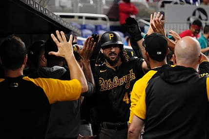 Jul 11, 2022; Miami, Florida, USA; Pittsburgh Pirates center fielder Jake Marisnick (41) celebrates with teammates in the dugout after hitting a two-run home run in the ninth inning against the Miami Marlins at loanDepot park. Mandatory Credit: Jasen Vinlove-USA TODAY Sports