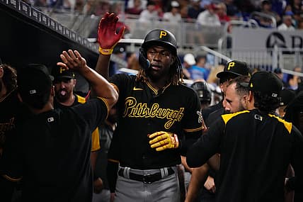 Jul 12, 2022; Miami, Florida, USA; Pittsburgh Pirates shortstop Oneil Cruz (15) celebrates in the dugout after scoring a run in the fifth inning against the Miami Marlins at loanDepot park. Mandatory Credit: Jasen Vinlove-USA TODAY Sports