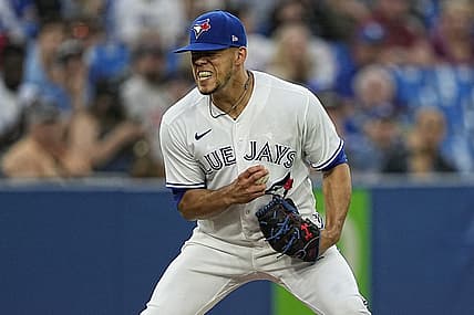 Jul 12, 2022; Toronto, Ontario, CAN; Toronto Blue Jays pitcher Jose Berrios (17) reacts after not being able to make a play on a ball bunted by Philadelphia Phillies catcher Garrett Stubbs (not pictured) during the fifth inning at Rogers Centre. Mandatory Credit: John E. Sokolowski-USA TODAY Sports