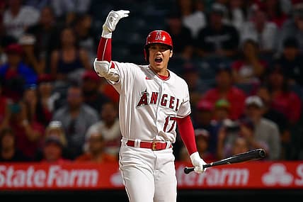 Jul 12, 2022; Anaheim, California, USA; Los Angeles Angels designated hitter Shohei Ohtani (17) signals for left fielder Brandon Marsh (16) to score after Houston Astros relief pitcher Rafael Montero (47) throws a passed ball during the seventh inning at Angel Stadium. Mandatory Credit: Gary A. Vasquez-USA TODAY Sports