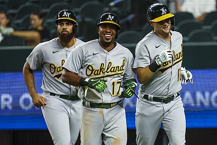 Jul 12, 2022; Arlington, Texas, USA; Oakland Athletics left fielder Chad Pinder (10) celebrates with Oakland Athletics third baseman Dermis Garcia (76) and Oakland Athletics shortstop Elvis Andrus (17) after hitting a grand slam home run during the twelfth inning against the Texas Rangers at Globe Life Field. Mandatory Credit: Kevin Jairaj-USA TODAY Sports