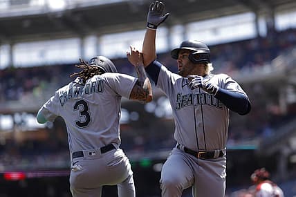Jul 13, 2022; Washington, District of Columbia, USA; Seattle Mariners third baseman Eugenio Suarez (28) celebrates with Mariners shortstop J.P. Crawford (3) after hitting a three run home run against the Washington Nationals during the first inning at Nationals Park. Mandatory Credit: Geoff Burke-USA TODAY Sports