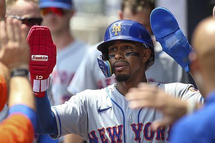 Jul 13, 2022; Atlanta, Georgia, USA; New York Mets shortstop Francisco Lindor (12) celebrates after scoring a run against the Atlanta Braves in the seventh inning at Truist Park. Mandatory Credit: Brett Davis-USA TODAY Sports