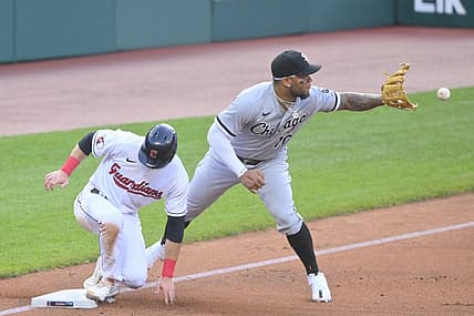 Jul 13, 2022; Cleveland, Ohio, USA; Cleveland Guardians second baseman Owen Miller (6) advances to third base beside Chicago White Sox third baseman Yoan Moncada (10) on a sacrifice fly ball in the third inning at Progressive Field. Mandatory Credit: David Richard-USA TODAY Sports