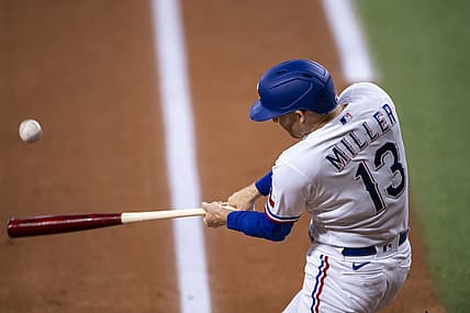 Jul 13, 2022; Arlington, Texas, USA; Texas Rangers left fielder Brad Miller (13) drives in two runs on a single against the Oakland Athletics during the first inning at Globe Life Field. Mandatory Credit: Jerome Miron-USA TODAY Sports