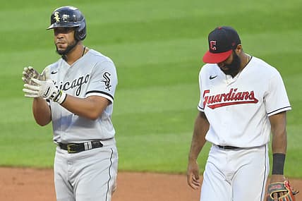 Jul 13, 2022; Cleveland, Ohio, USA; Chicago White Sox first baseman Jose Abreu (79) celebrates his RBI double beside Cleveland Guardians shortstop Amed Rosario (1) in the sixth inning at Progressive Field. Mandatory Credit: David Richard-USA TODAY Sports