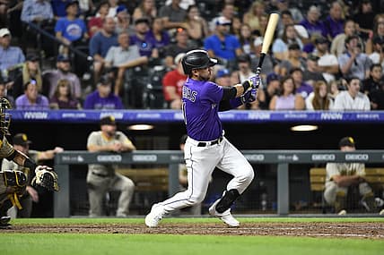 Jul 13, 2022; Denver, Colorado, USA; Colorado Rockies shortstop Jose Iglesias (11) hits a two run RBI in the seventh inning against the San Diego Padres at Coors Field. Iglesias ended the game with a 6 RBI night. Mandatory Credit: John Leyba-USA TODAY Sports