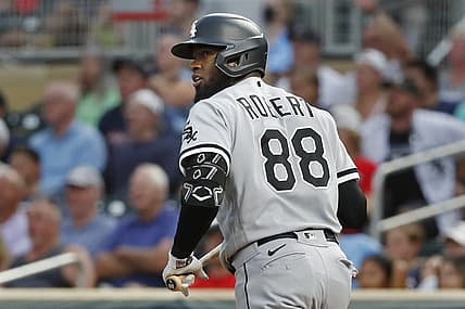 Jul 14, 2022; Minneapolis, Minnesota, USA; Chicago White Sox center fielder Luis Robert (88) watches his grand slam against the Minnesota Twins in the fourth inning at Target Field. Mandatory Credit: Bruce Kluckhohn-USA TODAY Sports