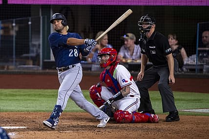 Jul 14, 2022; Arlington, Texas, USA; Seattle Mariners third baseman Eugenio Suarez (28) hits a single and drives in two runs against the Texas Rangers during the seventh inning at Globe Life Field. Mandatory Credit: Jerome Miron-USA TODAY Sports