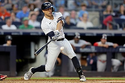 Jul 15, 2022; Bronx, New York, USA; New York Yankees right fielder Giancarlo Stanton (27) hits a three run home run against the Boston Red Sox during the third inning at Yankee Stadium. Mandatory Credit: Brad Penner-USA TODAY Sports