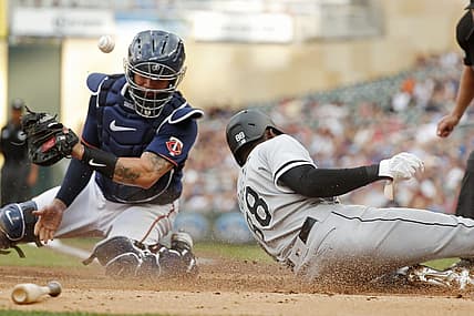 Jul 15, 2022; Minneapolis, Minnesota, USA; Chicago White Sox center fielder Luis Robert (88) scores from second base past Minnesota Twins catcher Gary Sanchez (24) in the first inning at Target Field. Mandatory Credit: Bruce Kluckhohn-USA TODAY Sports