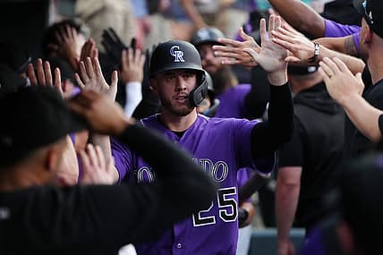Jul 15, 2022; Denver, Colorado, USA; Colorado Rockies first baseman C.J. Cron (25) celebrates scoring a run in the fifth inning Colorado Rockies at Coors Field. Mandatory Credit: Ron Chenoy-USA TODAY Sports