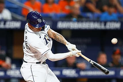 Jul 15, 2022; St. Petersburg, Florida, USA;  Tampa Bay Rays first baseman Christian Bethancourt (14) hits a two-run home run against the Baltimore Orioles in the sixth inning at Tropicana Field. Mandatory Credit: Nathan Ray Seebeck-USA TODAY Sports