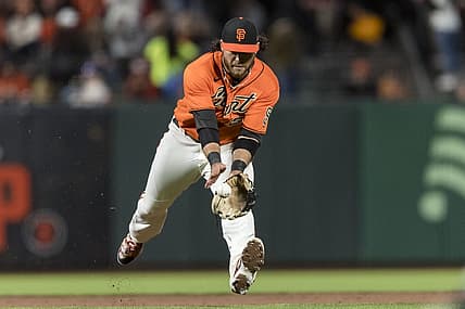 Jul 15, 2022; San Francisco, California, USA;  San Francisco Giants shortstop Brandon Crawford (35) fields a ground ball against the Milwaukee Brewers during the sixth inning at Oracle Park. Mandatory Credit: John Hefti-USA TODAY Sports