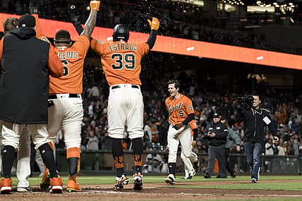Jul 15, 2022; San Francisco, California, USA;  San Francisco Giants right fielder Mike Yastrzemski (5) celebrates with teammates after he hit a grand slam for a walkoff win against the Milwaukee Brewers  at Oracle Park. Mandatory Credit: John Hefti-USA TODAY Sports